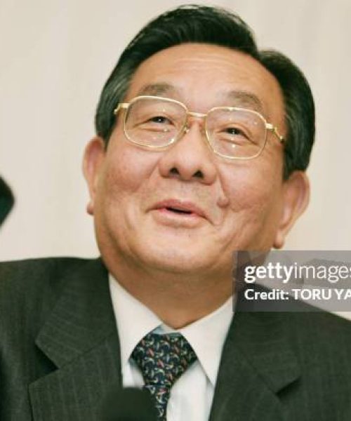 President of Japan's largest tiremaker Bridgestone Corp. Shigeo Watanabe smiles as he answers questions during a press conference in Tokyo, 18 February 2005. The world's second-largest tiremaker 18 February said its net profit for 2004 rose about 30 percent as strong US and European sales offset the drag of a high yen and rising raw material costs.         AFP PHOTO/Toru YAMANAKA (Photo by TORU YAMANAKA / AFP) (Photo by TORU YAMANAKA/AFP via Getty Images)